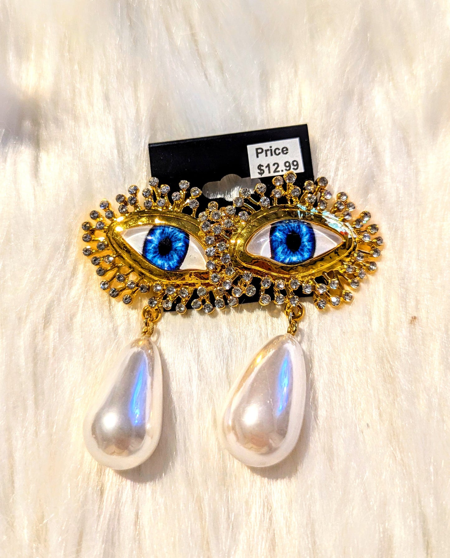 Pearl eye drop earrings
